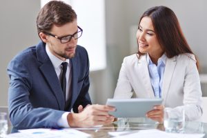 Portrait of smart businesswoman and businessman networking in office